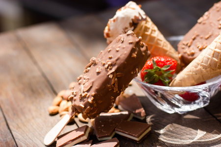 Ice cream with hazelnut, almondvanilla, caramel, with vanilla on rustic table