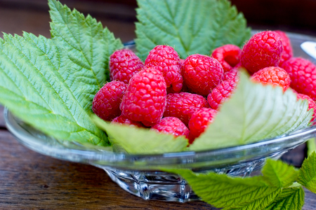 Juicy organic raspberry, raspberries in bowl close-upの写真素材