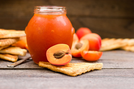 Homemade delicious apricot jam - marmalade on tableの写真素材