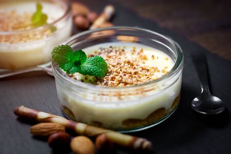 Cheesecake creamy with nuts closeup on tableの写真素材