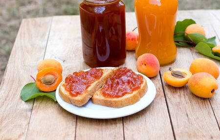 Homemade apricot jam (marmalade) on bread, delicios and healthy breakfastの写真素材