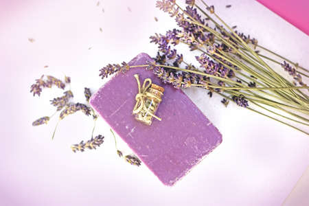 Homemade, handmade lavender soap and lavender flower on tableの写真素材