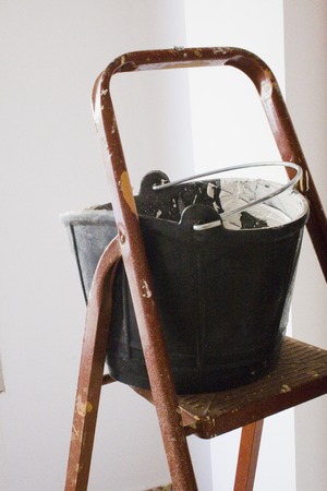 Dirty bucket and staircaseの写真素材