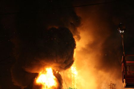 Burning Falla in Valencia. Big column of fire and cloud of smokeの写真素材
