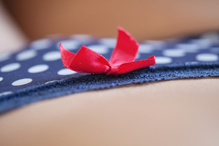 Erotic body (focus on the bow)の写真素材
