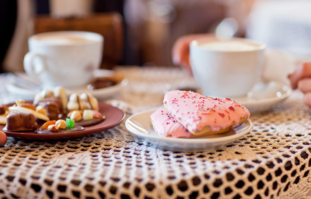 Wedding cookies and two cups of coffeeの写真素材