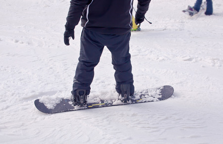 A snowboarder descends from the mountain, fragmentの写真素材