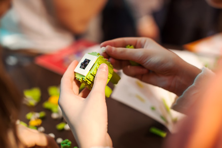 Girl building blocks of the green toy.の写真素材