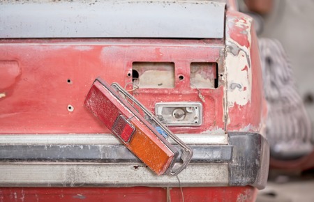 Close-up photo backlight of red rusty car.の写真素材
