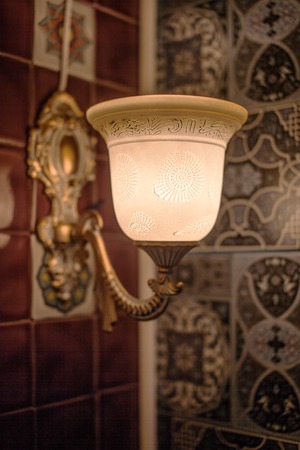 Vintage lamp in boho style at the wall backgroundの写真素材