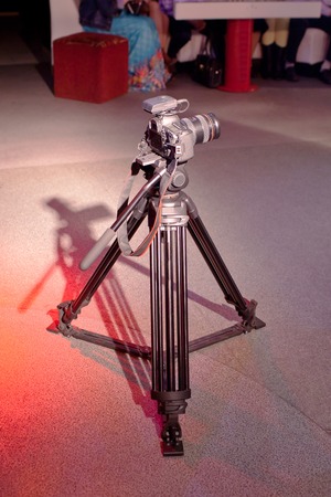 Close-up photo of DSLR camera on tripod.の写真素材