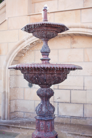 Lithic fountain with dripping water.の写真素材