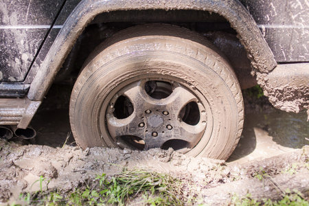 SUV got stuck in the mud, wheel closeup.