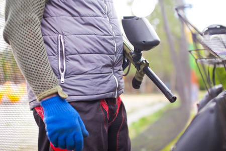 Man in paintball gear with a gun to game.の写真素材