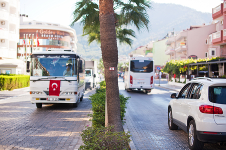 MARMARIS, TURKEY - 14 SEPTEMBER, 2015: Movement public transport on city street.のeditorial素材