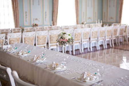 Hall with beautifully decorated wedding table.の写真素材