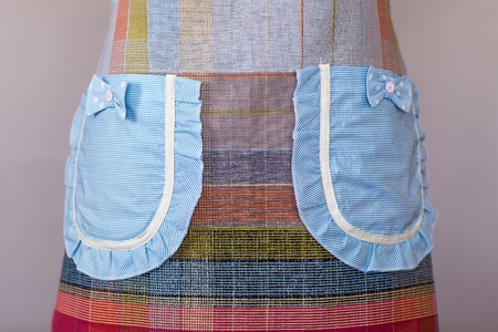 Blue kitchen female apron on mannequin.の写真素材