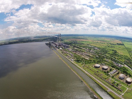 Aerial view of power station on the shore a large lake.の写真素材
