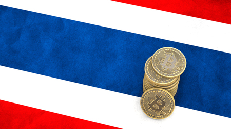 A pile of Bitcoin coins stands on the flag of Thailand. 3D render.の写真素材