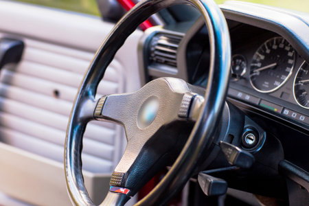 Black steering wheel of an old, retro car