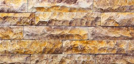 Stone in line for exterior works of red color, texture.