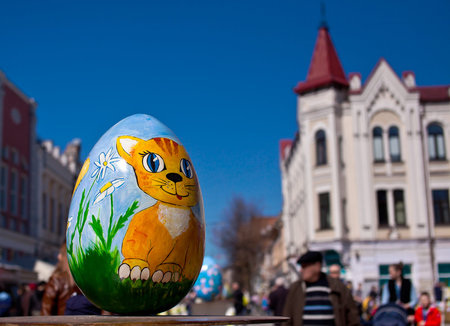 Zhitomir, Ukraine - April 10, 2018: Easter eggs with a painted cat on a background of the city.