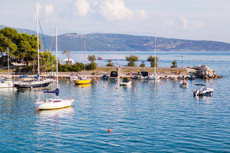Krk, Croatia - October 3, 2018: Yachts stand on the pier in the port of Krk island.のeditorial素材