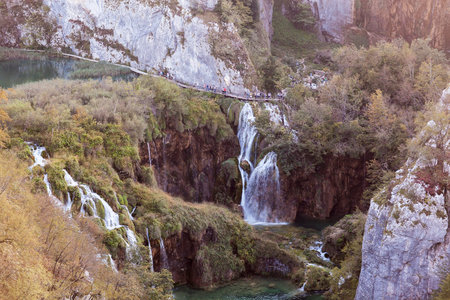 Plitvice Lakes, Croatia: September 23 2018: Tourists walk the route on a beautiful natural lake.のeditorial素材