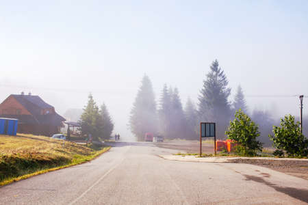 Morning fog on the road in the Slovak Tatra Mountainsの写真素材