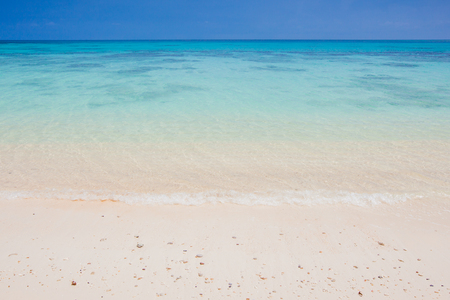 Soft wave of the sea on the sand beachの写真素材