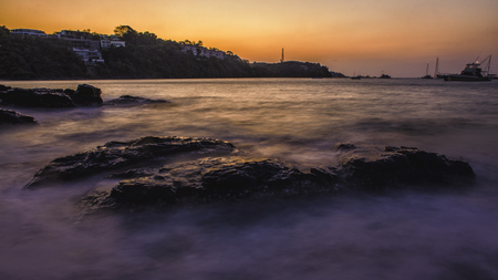 Smooth ocean on the rock in the morningの写真素材