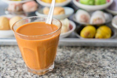Thai hot tea breakfast in south Thailand with dimsum backgroundの写真素材