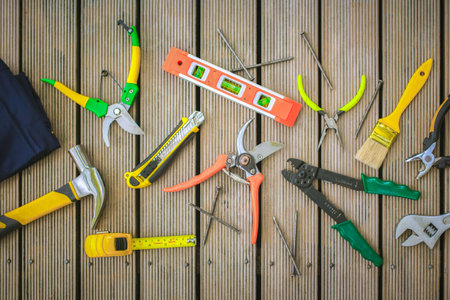Flat lay composition with gardening tools on wooden backgroundの写真素材