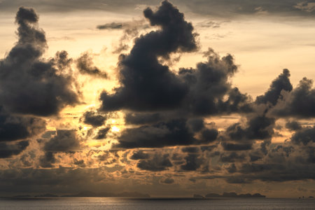 golden sunrise with cloudy sky in the morning. Harmony and beauty in nature. Scenic peaceful sea viewの写真素材