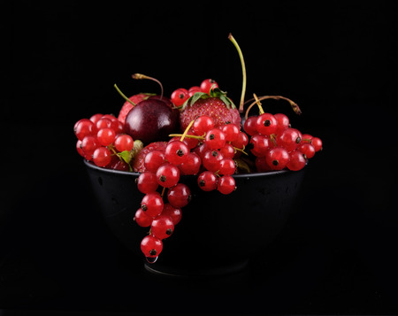 fresh red  fruit on black backgroundの写真素材