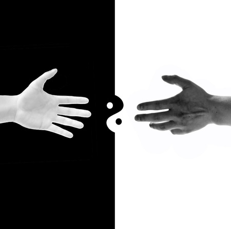 black and white hands on black and white background with taoの写真素材