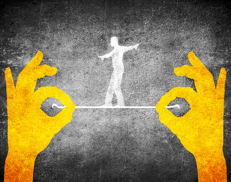 orange hands and tightrope walkerの写真素材