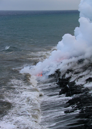 Lava flowing into ocean on Big Islandの写真素材