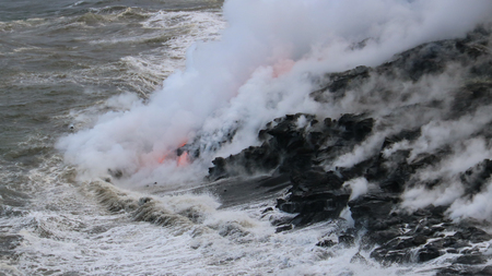 Lava flowing into the oceanの写真素材