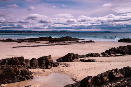 Stormy skies over the surf at Snapper Rocksの写真素材