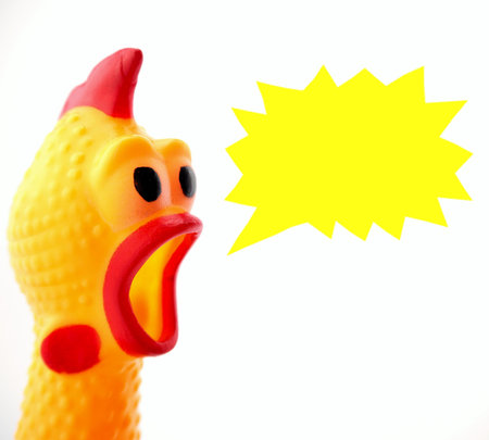 Yellow shrilling chicken with red lips on white background with dialog boxの写真素材
