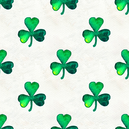Seamless background with St. Patrick's Day symbols. Watercolor hand drawn illustration with leaves of clover. Holiday pattern.の写真素材
