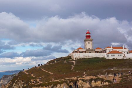 CABO DA ROCA, PORTUGAL - September 20, 2019: Tourists near lighthouse in Cabo da Roca, the western point of Europe, Sintra, Portugalのeditorial素材