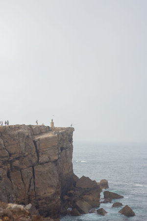 Papoa cliffs and Atlantic ocean in Peniche. Beautiful rocks blue sky and sea. Portugal
