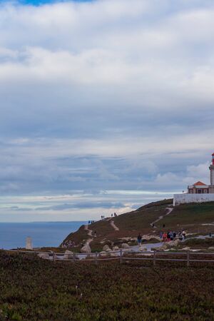 CABO DA ROCA, PORTUGAL - September 20, 2019: Tourists near lighthouse in Cabo da Roca, the western point of Europe, Sintra, Portugalのeditorial素材
