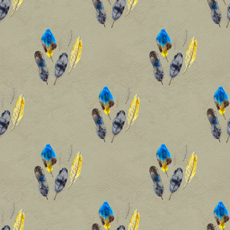 Watercolor seamless pattern. Hand painted texture with various multicolor bird feathers.の写真素材