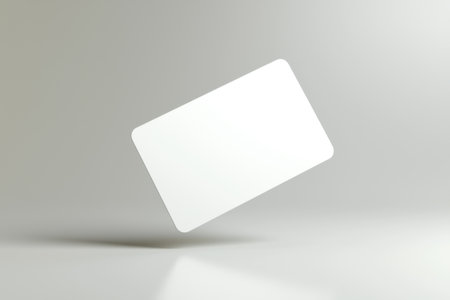 Minimalist 3d render of a floating white blank plastic card over a gray background, perfect for showcasing designs, logos, or branding elementsの素材