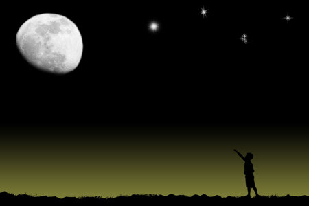 The boy specifies in the bright moonの写真素材