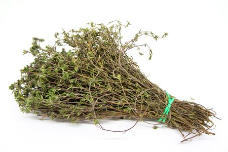 A bunch of aromatic dried thyme on white background for cookingの写真素材