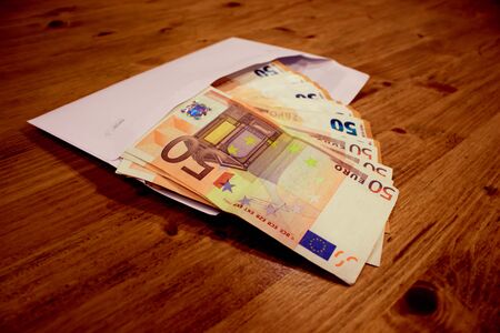50 euro banknotes falling out of the envelope.の写真素材